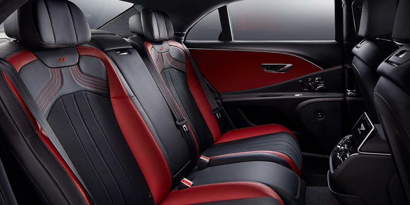 Bentley Polanco Bentley Flying Spur S sedan rear interior in Beluga black and Hotspur red hide with S stitching