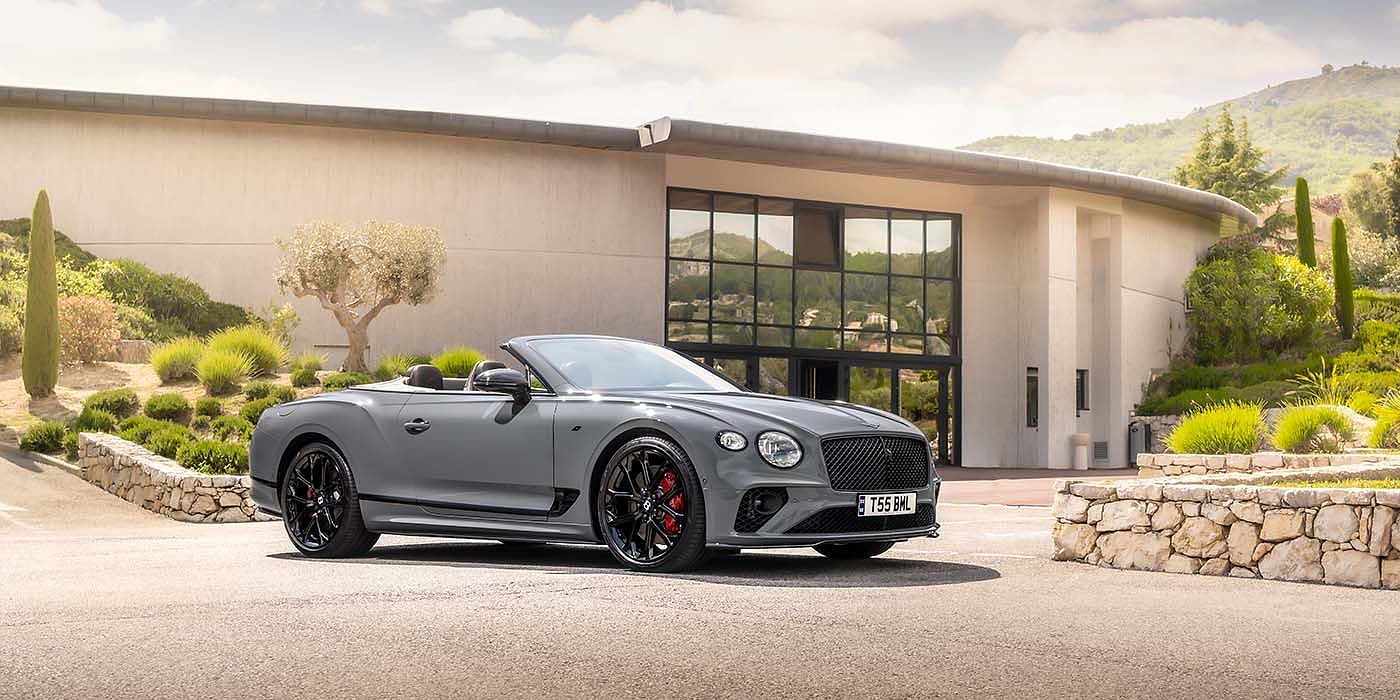 Bentley Polanco Bentley Continental GTC S convertible in Cambrian Grey paint front 34 static near house