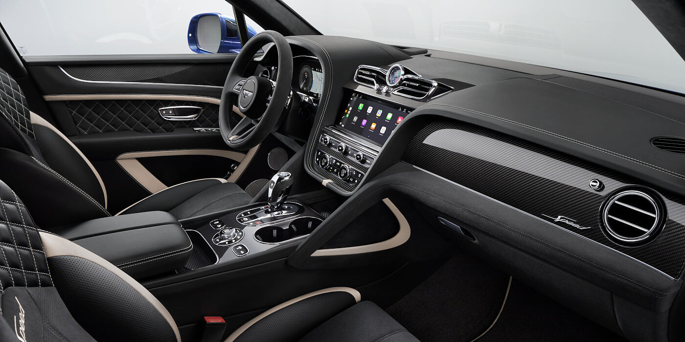 Bentley Polanco Bentley Bentayga Speed SUV front interior in Beluga black and Linen hide with carbon fibre veneer
