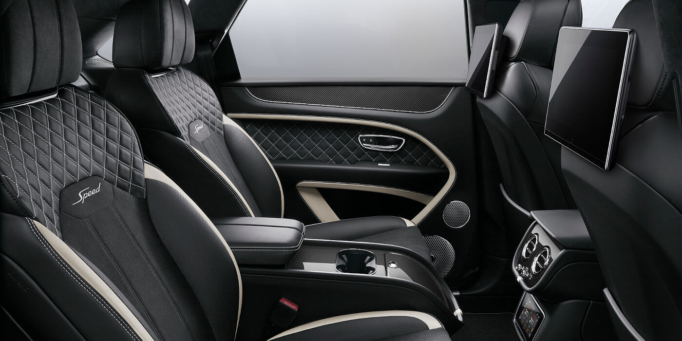 Bentley Polanco Bentley Bentayga Speed SUV rear interior in Beluga black and Linen hide with carbon fibre veneer