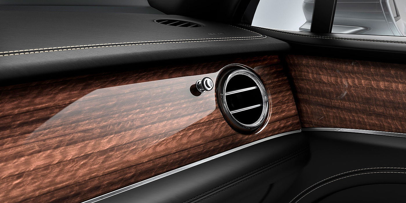 Bentley Polanco Bentley Bentayga front interior Crown Cut Walnut veneer and chrome air vent.