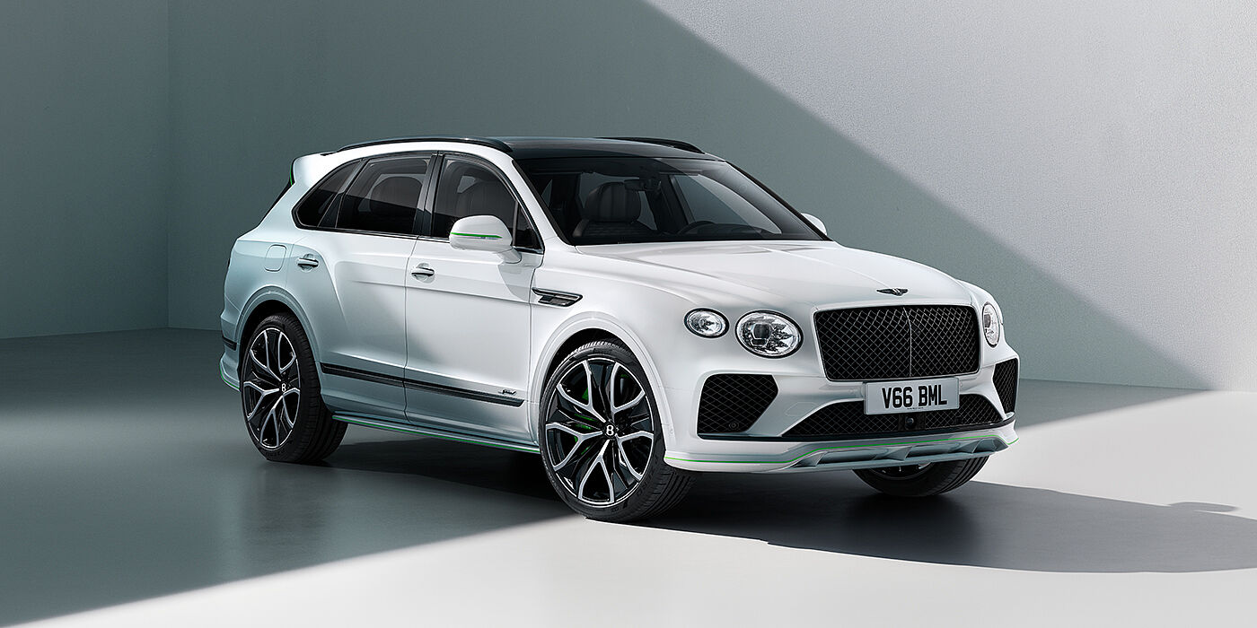 Bentley Polanco Bentley Bentayga Speed SUV front three quarter in Snow Quartz Pearlescent by Mulliner white paint against a grey wall