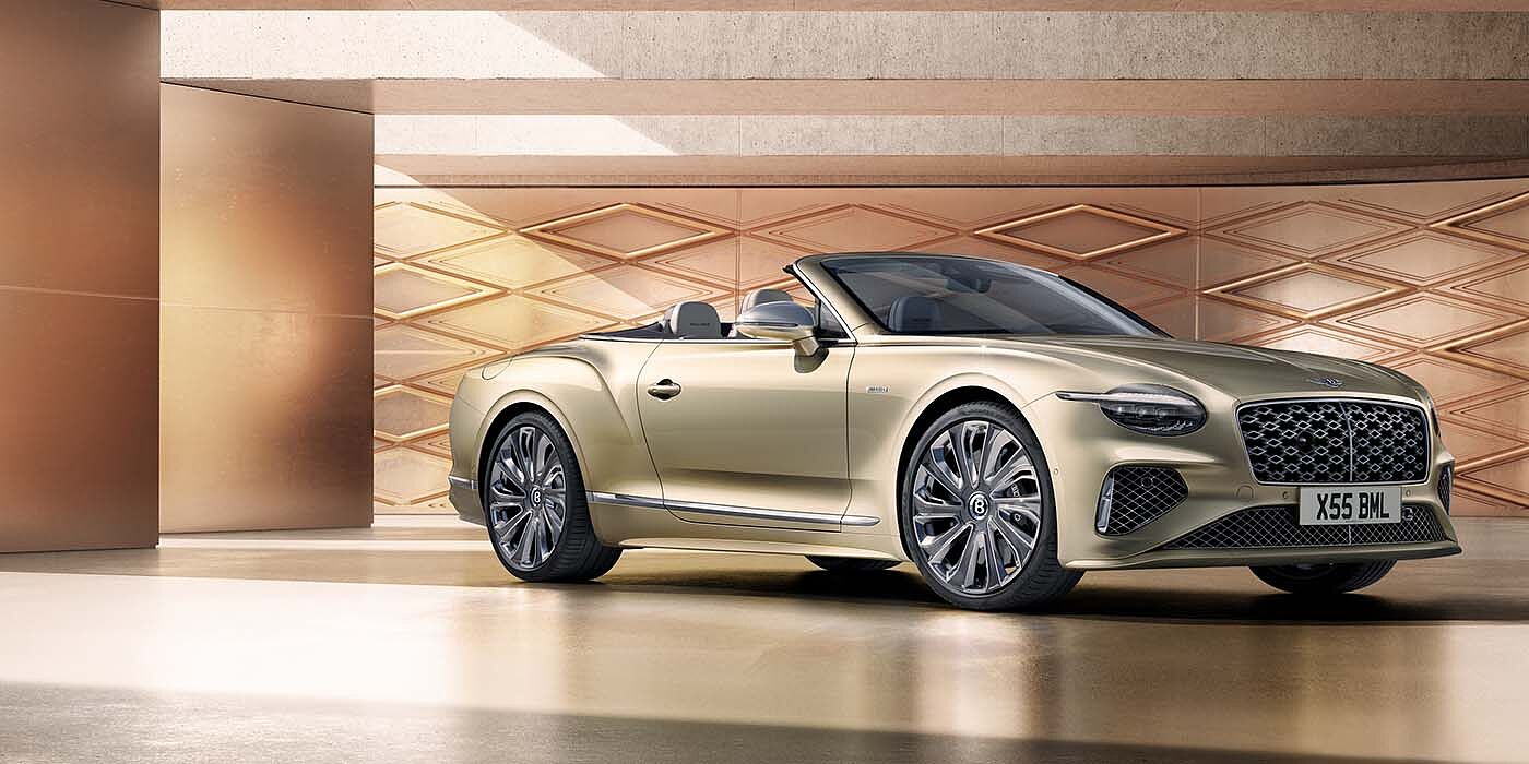 Bentley Polanco Bentley New Continental GTC Mulliner V8 hybrid front three quarters in Patina paint