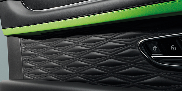 Bentley Polanco Bentley Bentayga Speed SUV interior door detail with Diamond in Diamond stitched hide in Beluga black colour, with Black stained Crown Cut Walnut veneer