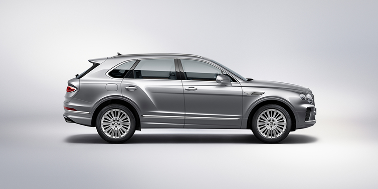 Bentley Polanco Bentley Bentayga SUV side profile in Moonbeam silver paint against white background featuring 21 inch 5 spoke wheels